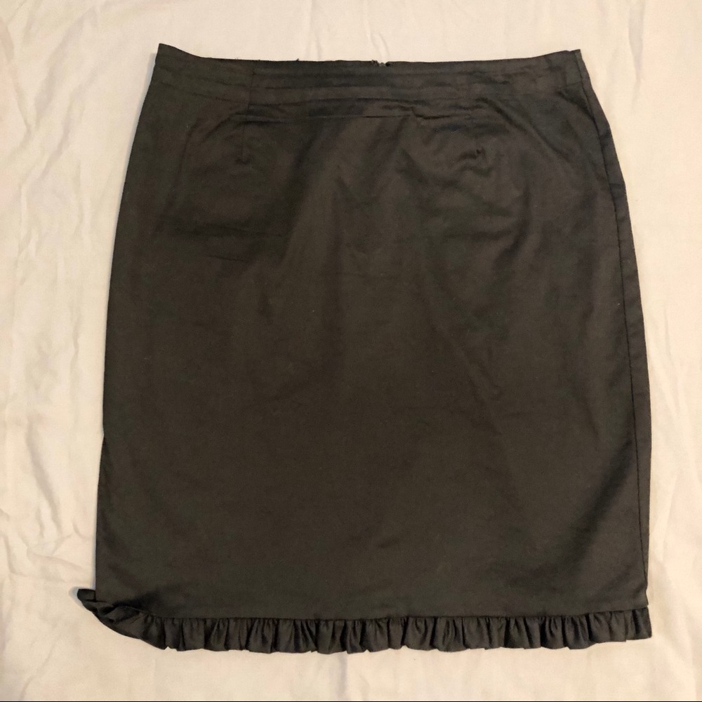 Black trumpet skirt w/ back slit.